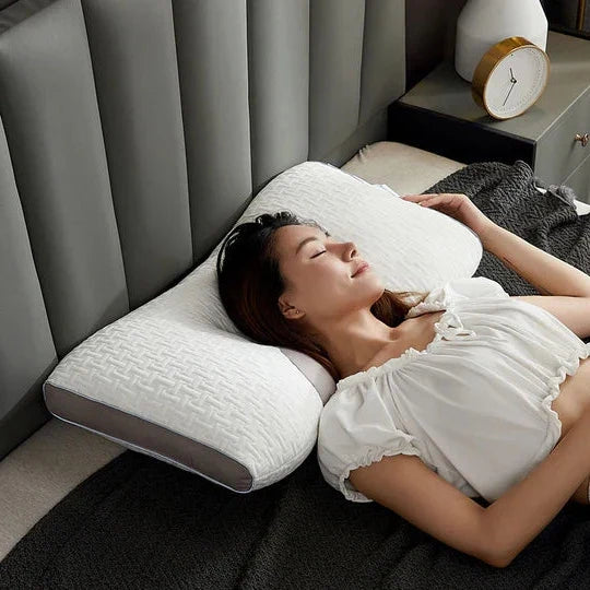 Unisex hybrid pillow providing orthopedic neck & shoulder support for both back and side sleepers.