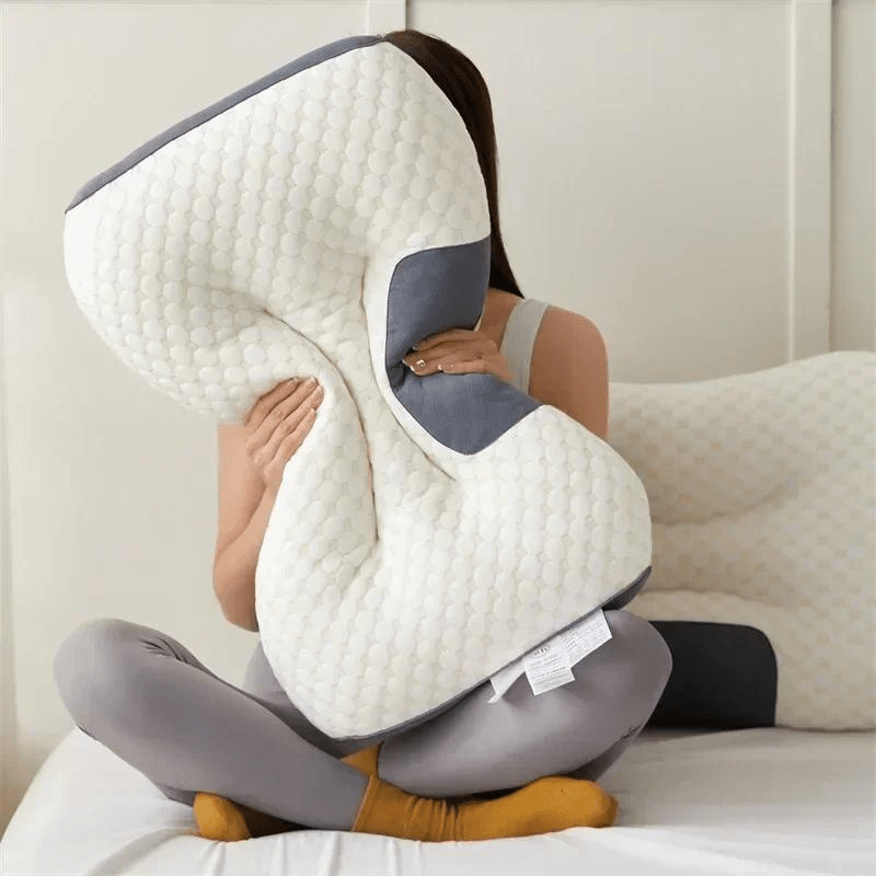 Ergonomic orthopedic pillow supporting a back sleeper's neck & spine, providing comfort & pain relief for better posture.
