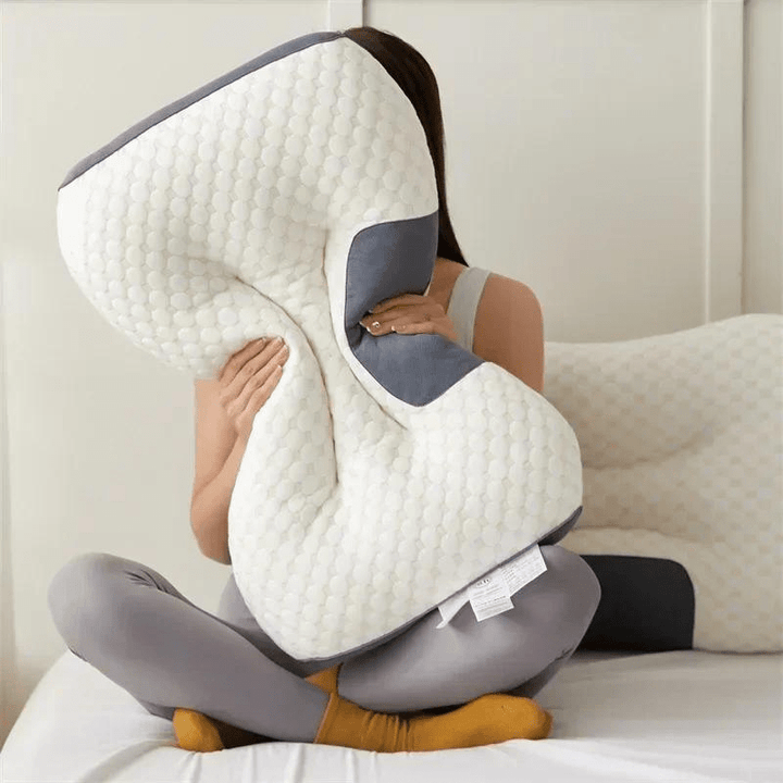 Ergonomic orthopedic pillow supporting a back sleeper's neck & spine, providing comfort & pain relief for better posture.