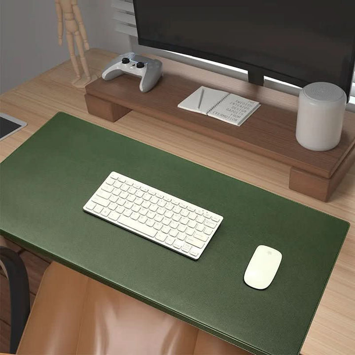 Home office essential: ergonomic PU leather desk mat with integrated wrist support for lasting comfort.