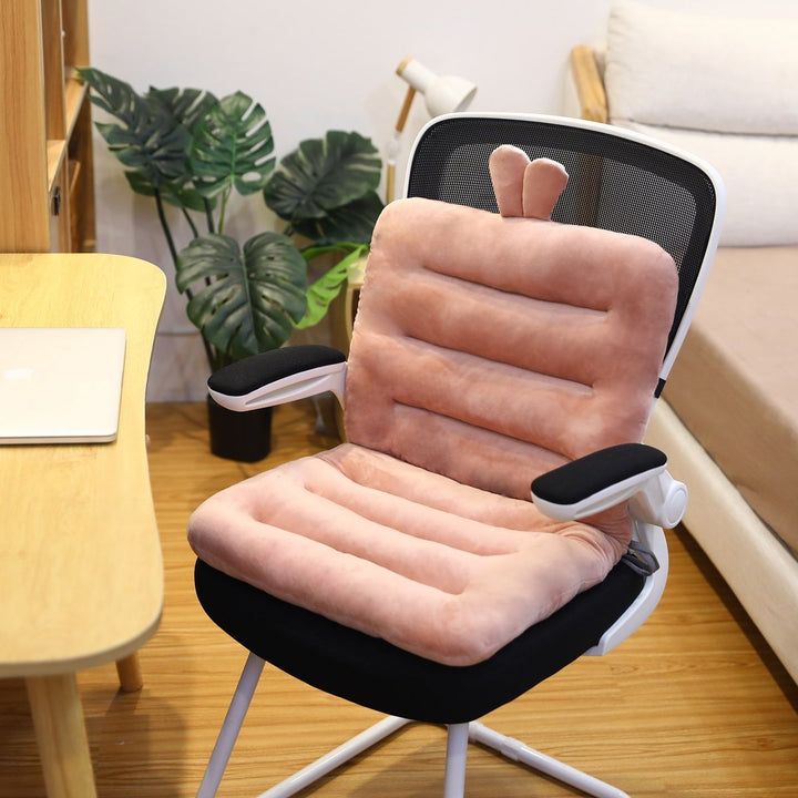 Posture corrector seat cushion for sciatica relief. Contoured design supports back for office or car.