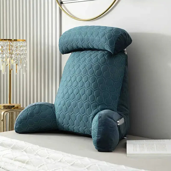 Ergonomic velvet back support pillow for comfortable reading in bed or on the couch, promoting relaxation.