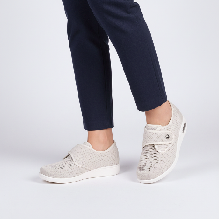 Beige leather women's comfort footwear, Esmeralda style, featuring a soft padded sole and wide fit.