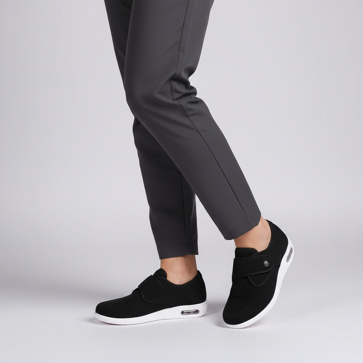 Woman's feet wearing Esmeralda comfort sneakers, highlighting the foot support and casual style.