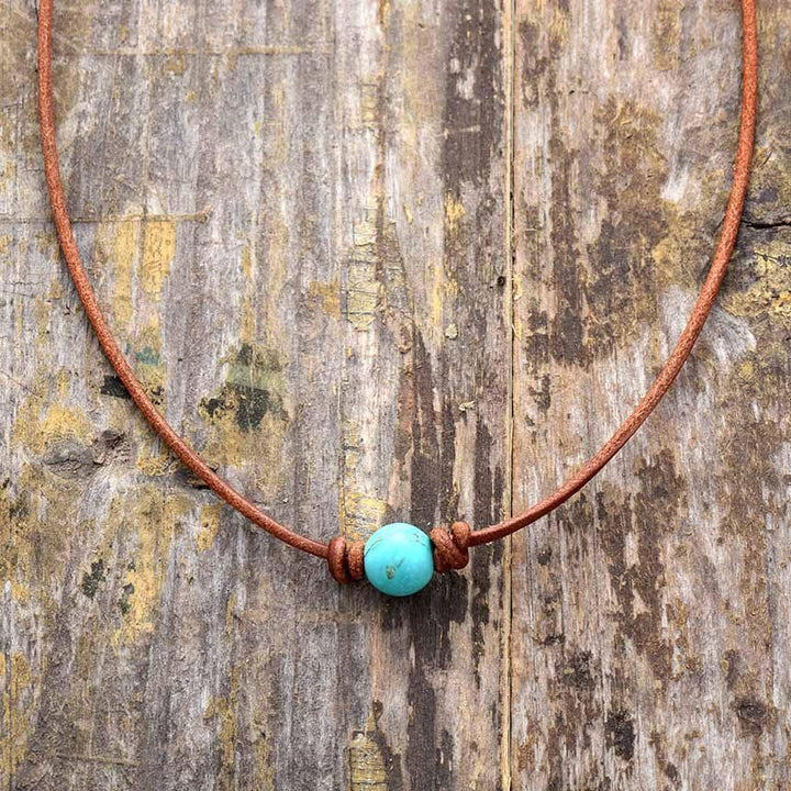 Handmade turquoise choker necklace for women, a unique boho chic statement piece featuring natural gemstones.