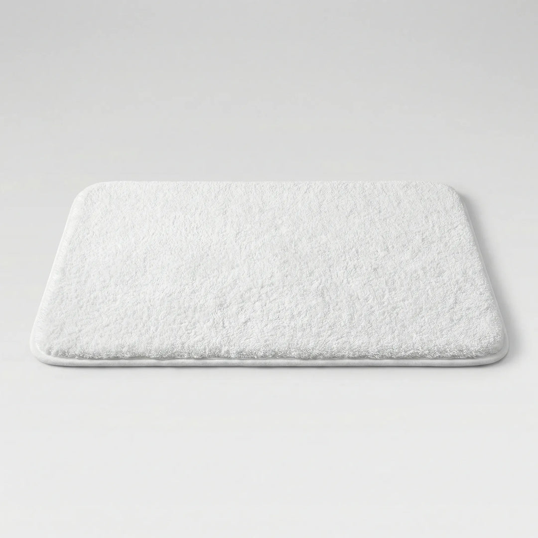 Flowique wave pattern bath mat. Extra thick, plush, and absorbent for modern bathroom decor.
