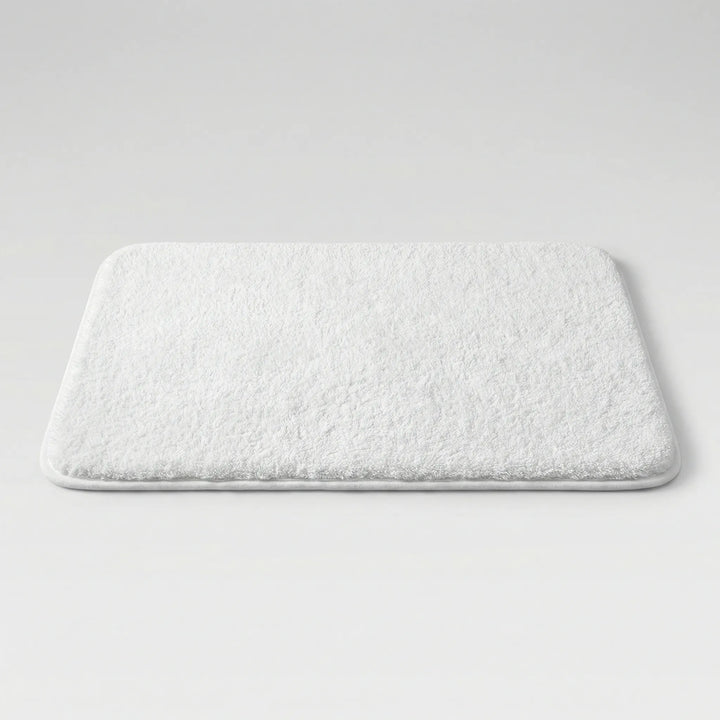 Flowique wave pattern bath mat. Extra thick, plush, and absorbent for modern bathroom decor.