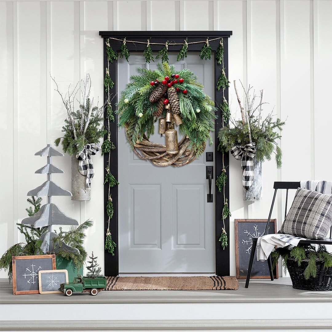 Handmade festive Christmas door wreath, blending farmhouse and boho styles for elegant holiday decor.