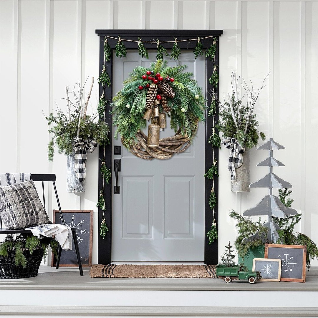 Charming Farmhouse Boho Christmas wreath, perfect door or wall decor. Rustic design with pinecones, berries & bells.