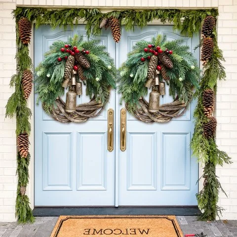 Boho Farmhouse Christmas wreath, festive holiday decor. Features realistic pinecones, red berries & golden accent bells.
