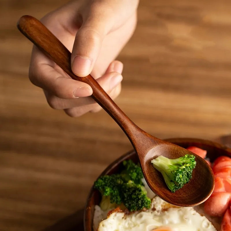 Durable wooden cooking spoons in a farmhouse style, perfect for stirring and baking in any kitchen.
