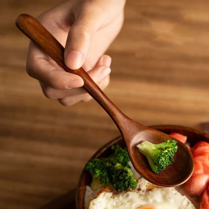 Durable wooden cooking spoons in a farmhouse style, perfect for stirring and baking in any kitchen.