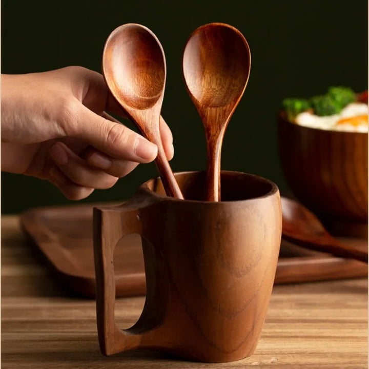 Assorted natural wood spoons, a versatile and durable farmhouse utensil set for cooking & serving.