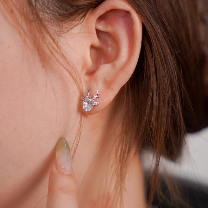 Hand-finished enamel reindeer studs. Unique sterling silver Christmas & winter jewelry for women.