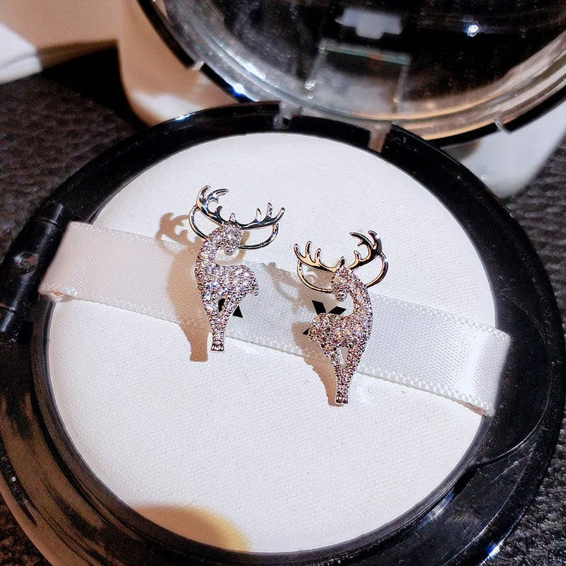Festive silver reindeer earrings for women, perfect for Christmas holiday parties & winter fashion.