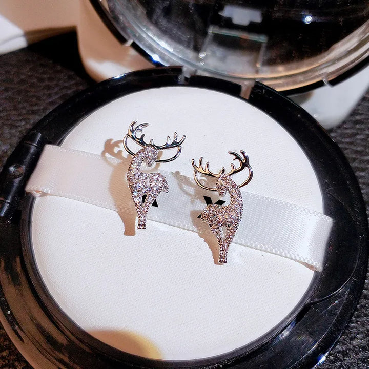Festive silver reindeer earrings for women, perfect for Christmas holiday parties & winter fashion.