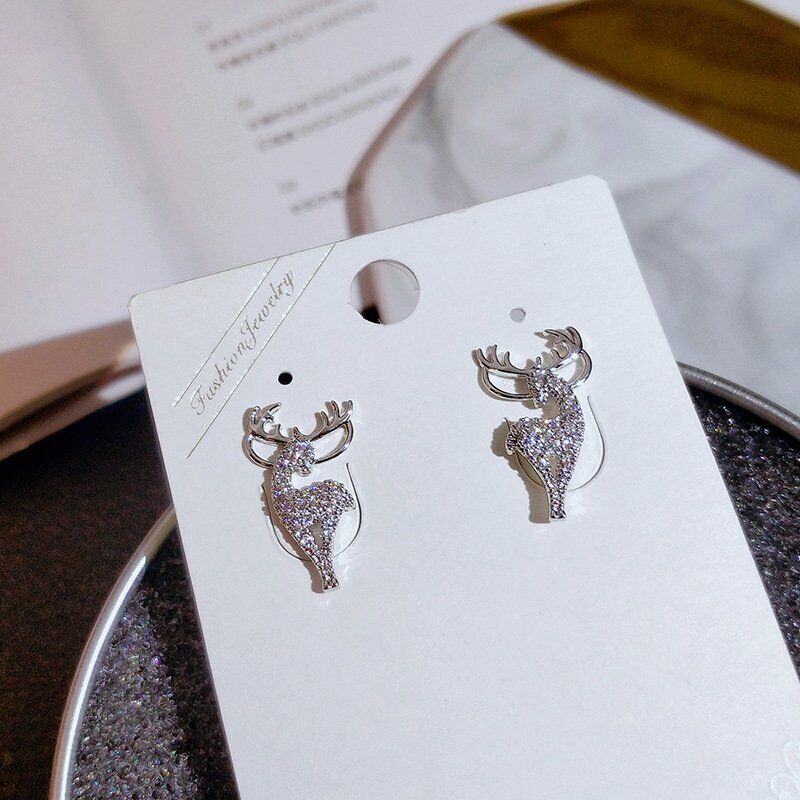 Charming women's Christmas reindeer earrings, a festive sterling silver gift for holiday fashion.