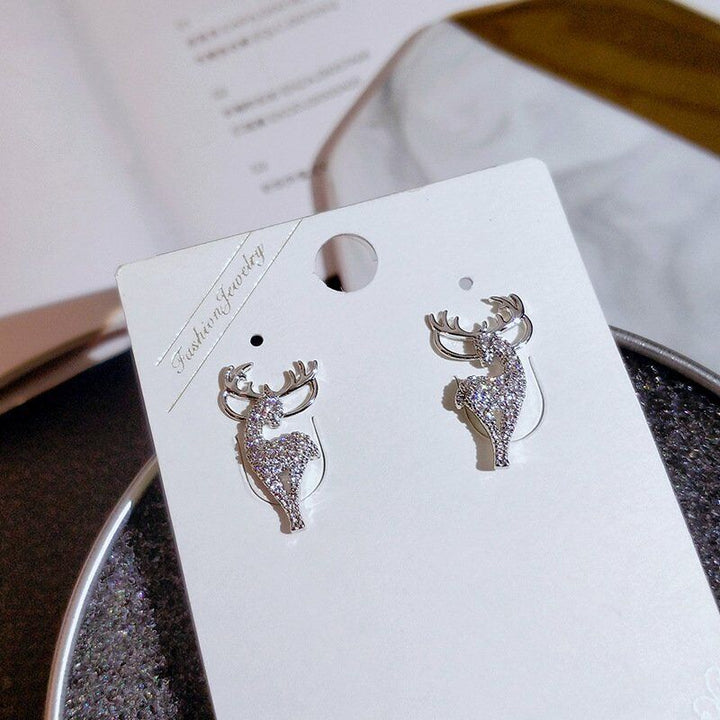 Charming women's Christmas reindeer earrings, a festive sterling silver gift for holiday fashion.