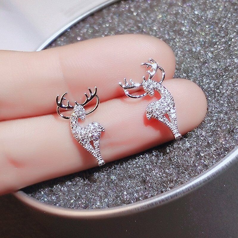 Elegant silver reindeer earrings, women's festive holiday jewelry for Christmas celebrations.