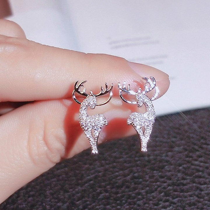 Women's festive sterling silver reindeer earrings, a stylish Christmas accessory & holiday gift.