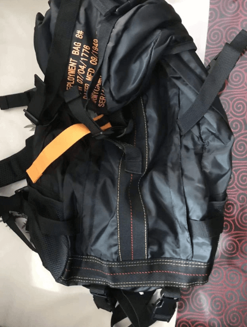Rugged men's large water-resistant tactical backpack, designed for outdoor adventures, hiking, and travel durability.