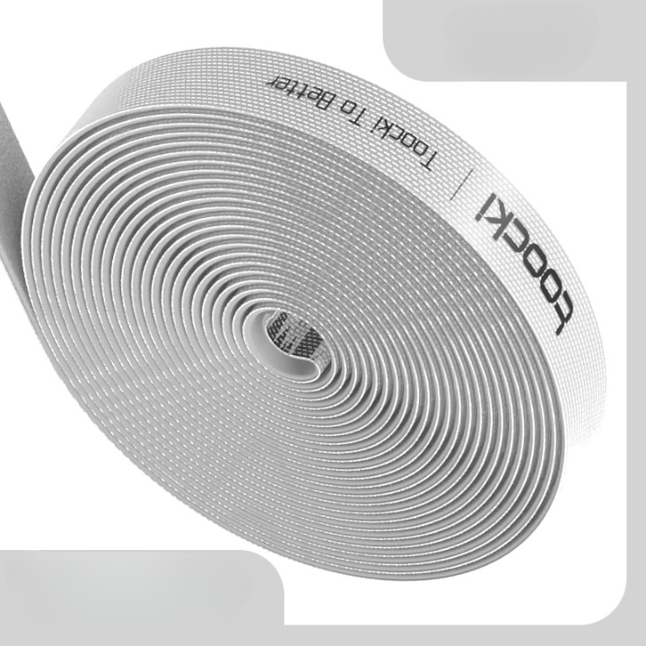 Flexible Cable Organiser Roll used to bundle charging cables and headphones together