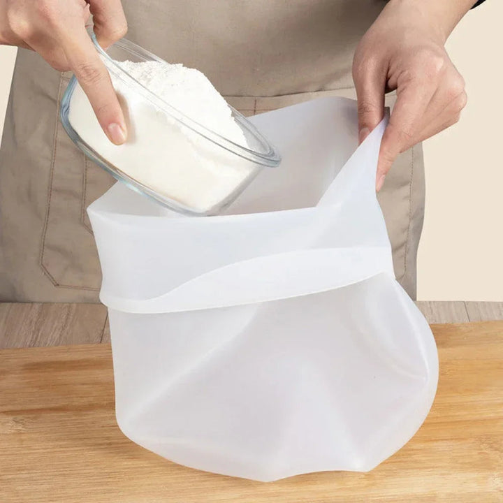 Flexible silicone kneading bag for dough prep. Reusable baking tool for homemade bread & pastries. Dishwasher safe.