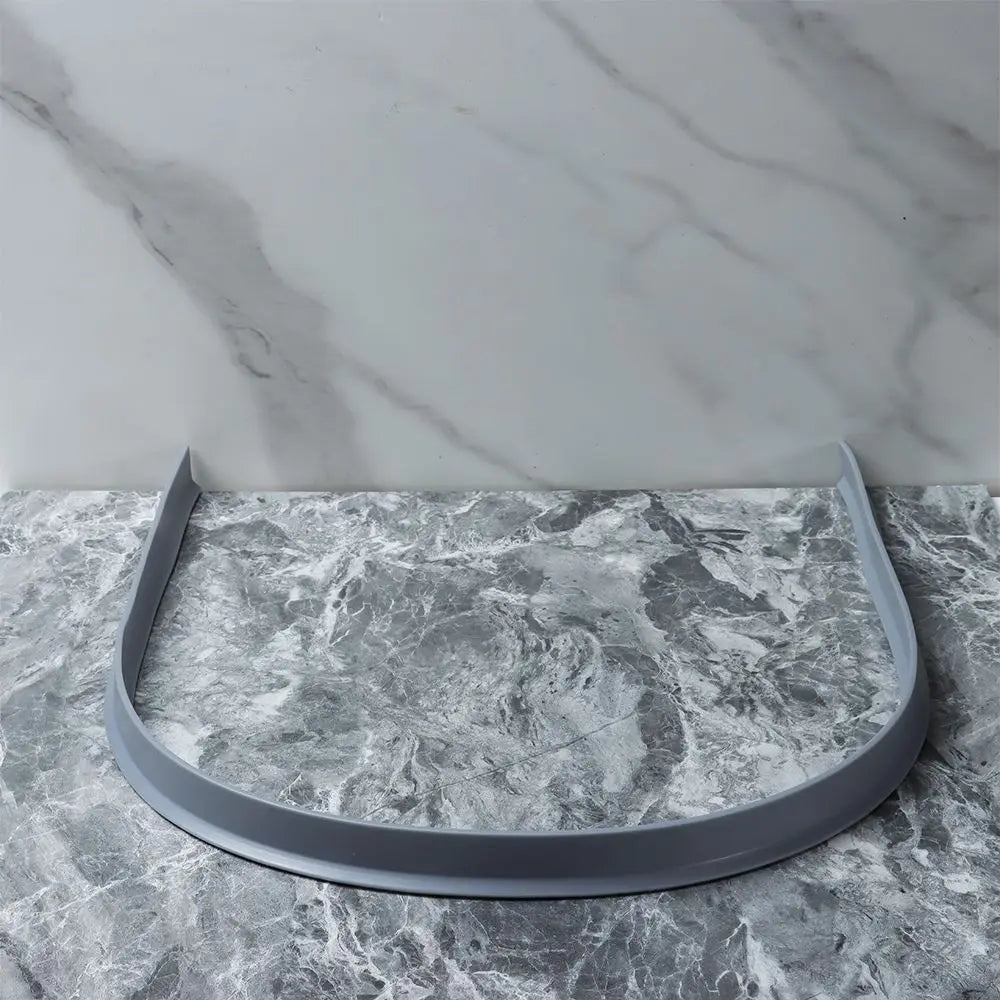 Versatile flexible silicone shower barrier, adaptable for curved or straight bathroom thresholds.