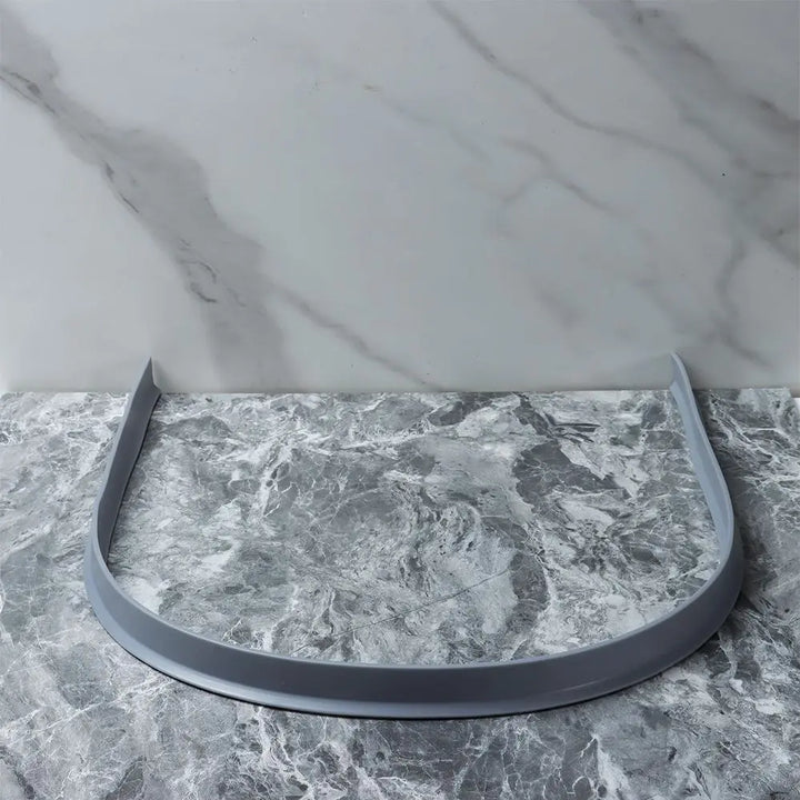 Versatile flexible silicone shower barrier, adaptable for curved or straight bathroom thresholds.
