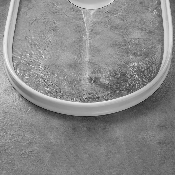 Durable silicone splash guard, a waterproof shower barrier for a consistently dry bathroom.