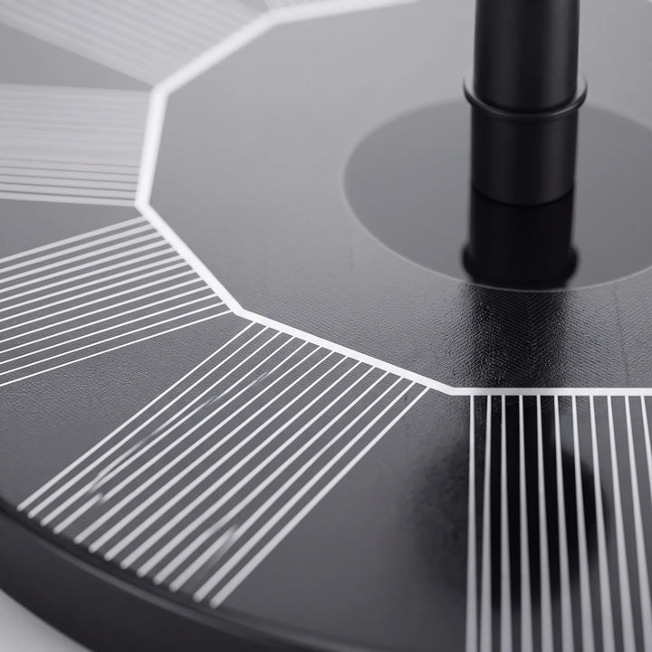 Close-up of a floating solar fountain with elegant water spray, ideal for garden ponds or bird baths.