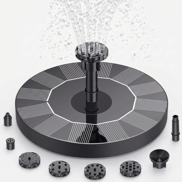 Decorative floating solar fountain spouting water, adding beauty to any garden, pond, or bird bath.