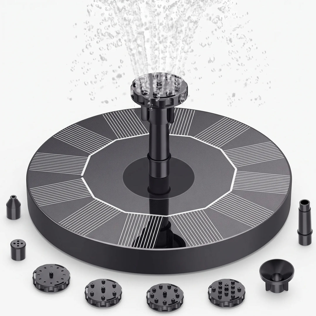 Easy-to-install floating solar fountain in a garden setting, perfect for bird baths or small ponds.