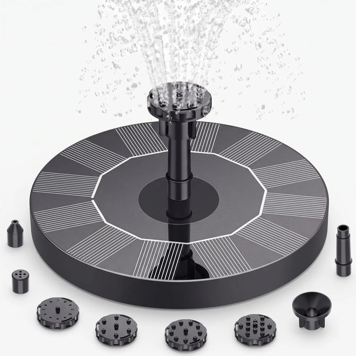 Easy-to-install floating solar fountain in a garden setting, perfect for bird baths or small ponds.