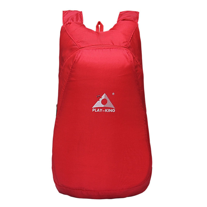 Water-resistant 20L backpack, open and packed, showcasing its spacious main compartment.