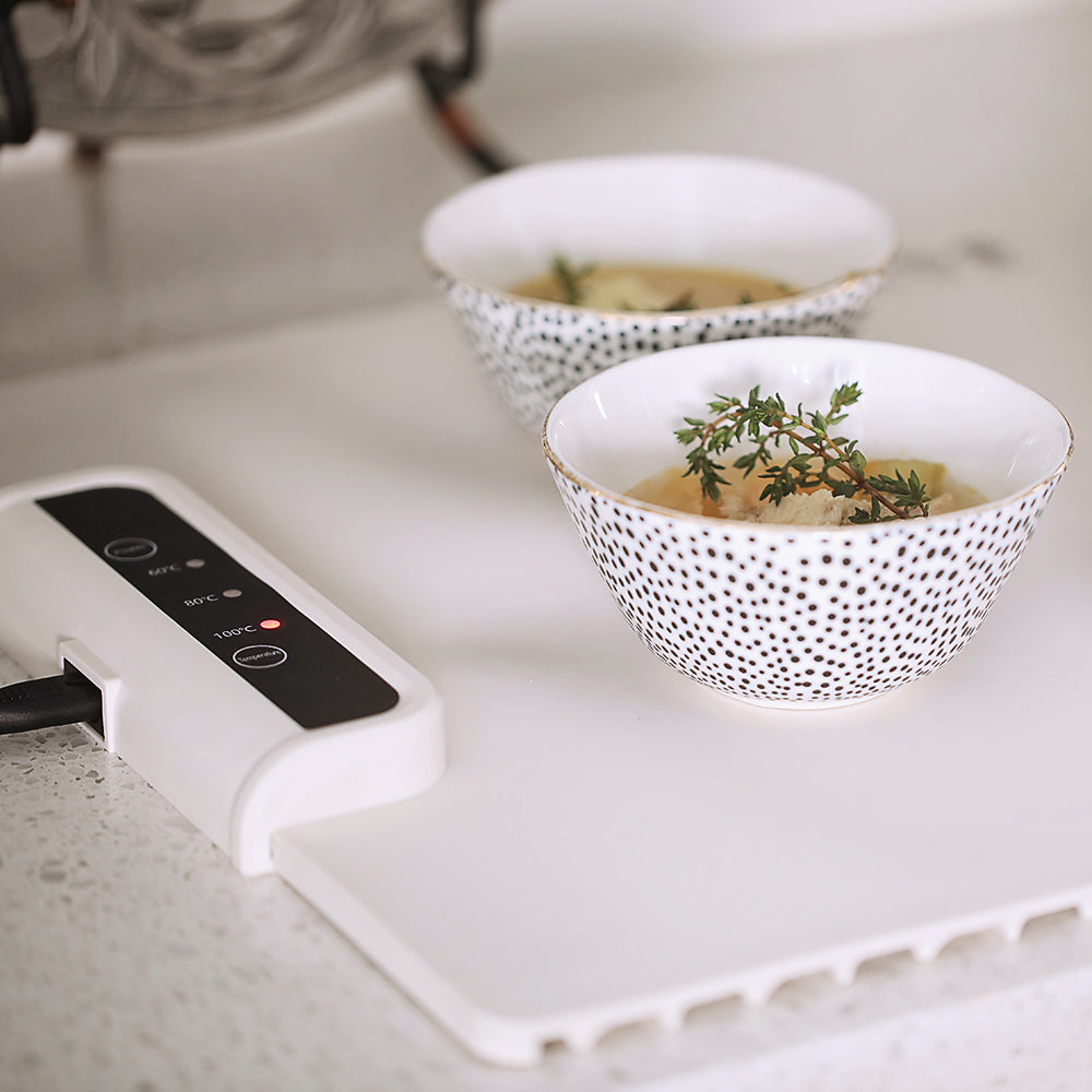 Portable silicone electric meal heater, a foldable warming tray for dinnerware, ideal for any occasion.