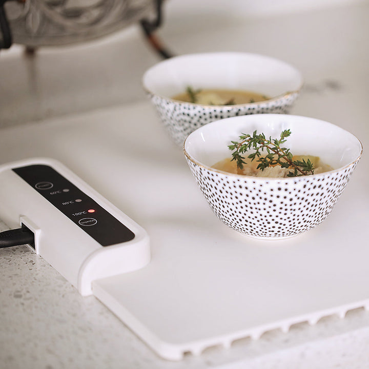 Portable silicone electric meal heater, a foldable warming tray for dinnerware, ideal for any occasion.