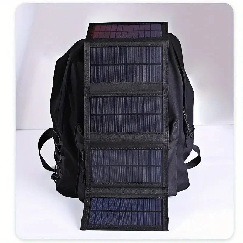 Foldable solar power bank charger for outdoor adventures. Portable, USB charging, ideal for camping, hiking, and travel.