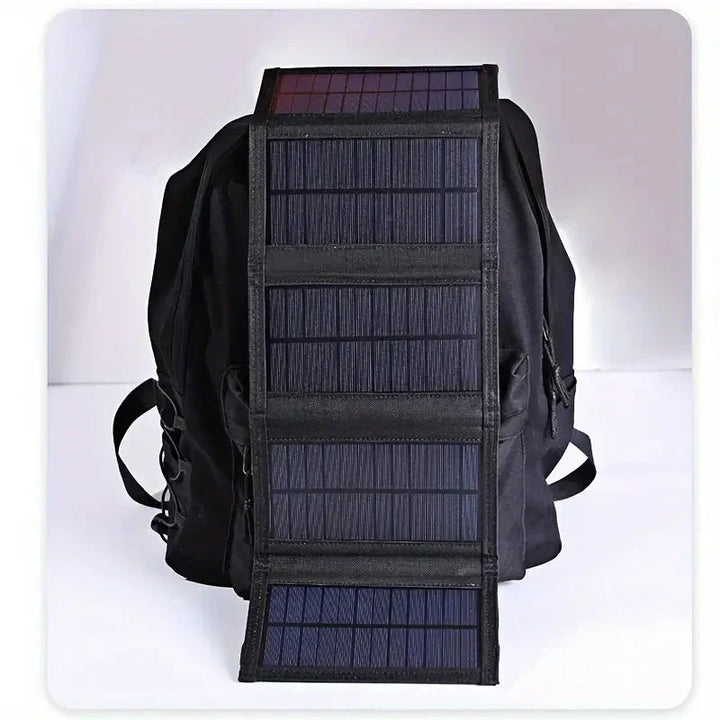 Foldable solar power bank charger for outdoor adventures. Portable, USB charging, ideal for camping, hiking, and travel.