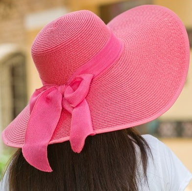 Stylish foldable wide brim women's beach hat, a perfect travel accessory for sun protection.