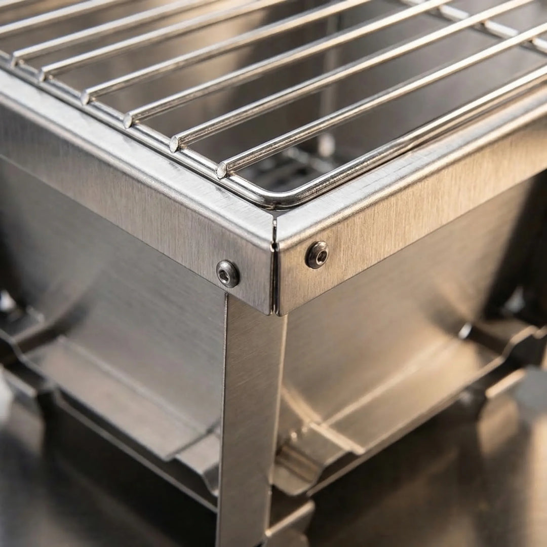 Portable outdoor charcoal & firewood BBQ grill. Ideal compact camping grill for wilderness cooking adventures.