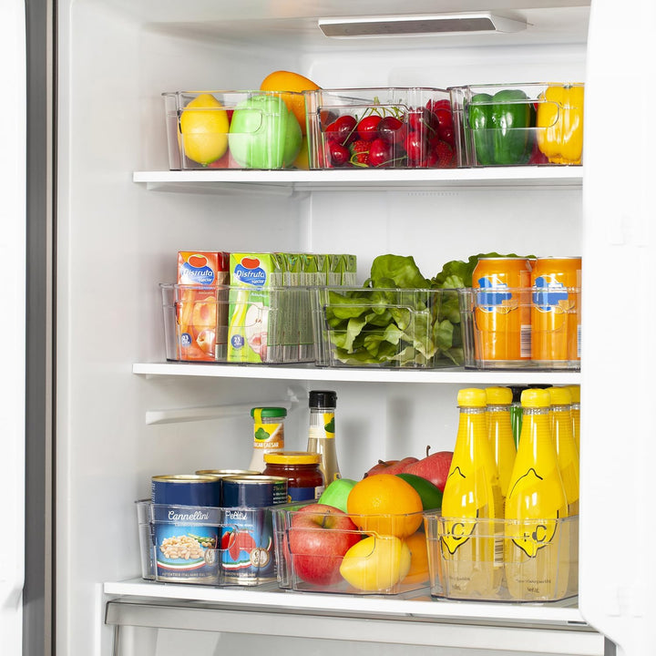 CoolOrganize clear bins, showcasing organized fruits and yogurts in a refrigerator.