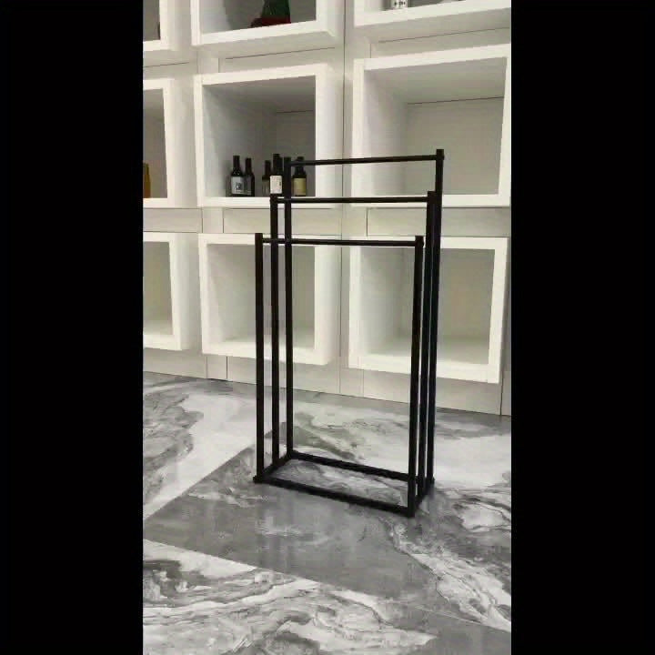 Modern freestanding towel rack, NeatRack, made of durable steel, adding elegance to home decor