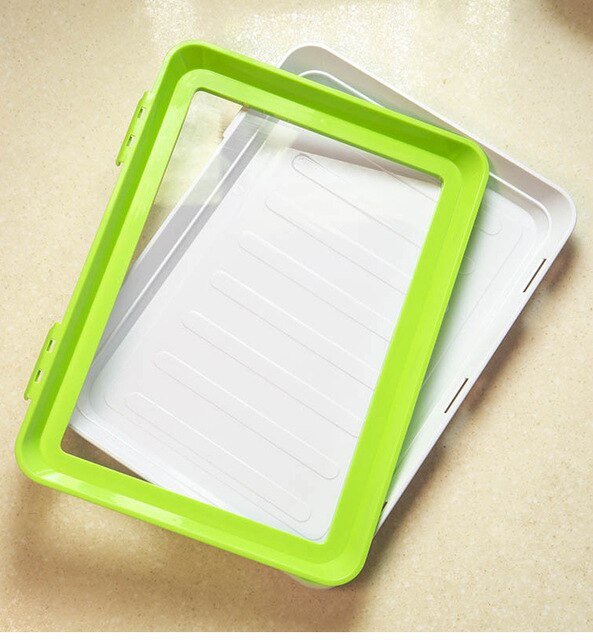 FreshSeal reusable food tray with raw meat, perfect for preserving freshness and meal prep in the refrigerator.