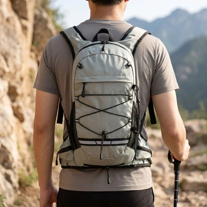 Front view of a blue unisex lightweight hiking daypack for trails and outdoor adventures.