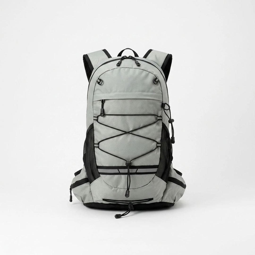 Person wearing a grey lightweight hiking daypack, perfect for trails, camping, and outdoor travel.