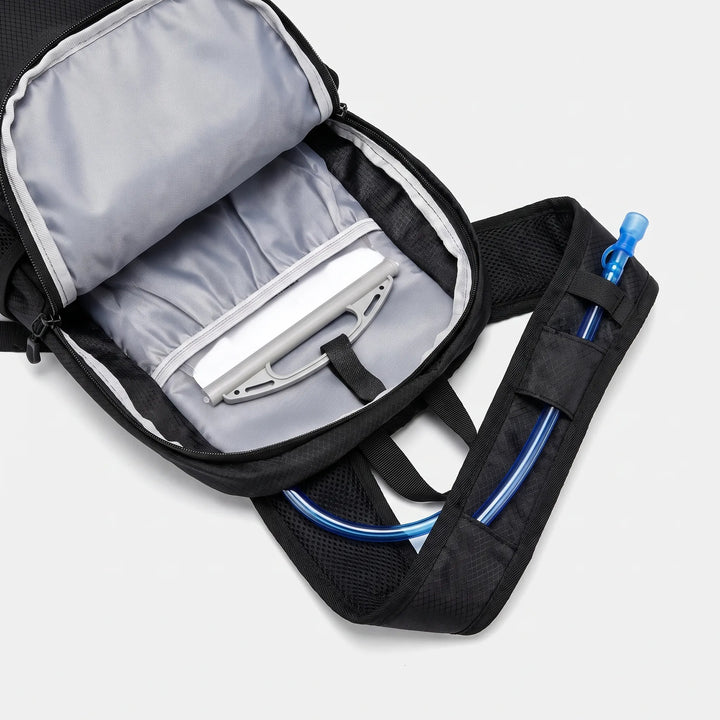 Side view of a compact black unisex daypack, an essential lightweight trail bag for adventure.
