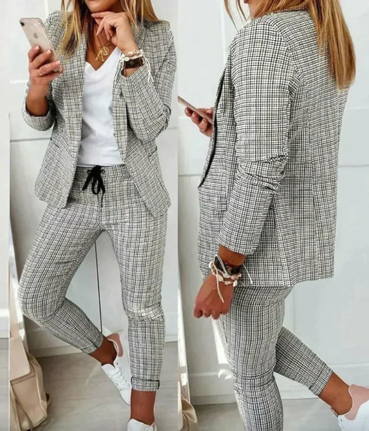 Close-up of a tailored Celeste women's luxury suit blazer, showcasing sophisticated style & quality fabric.