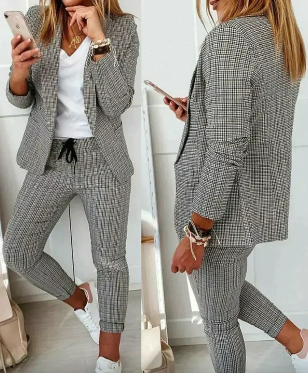 Stylish Celeste women's suit: tailored blazer & elegant trousers for business, formal wear, or office.