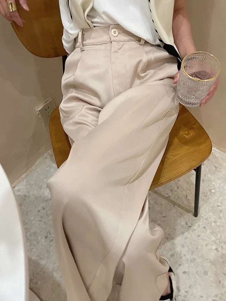 Elegant women's wide-leg pants, high-waisted & full-length, ideal for chic spring fashion.